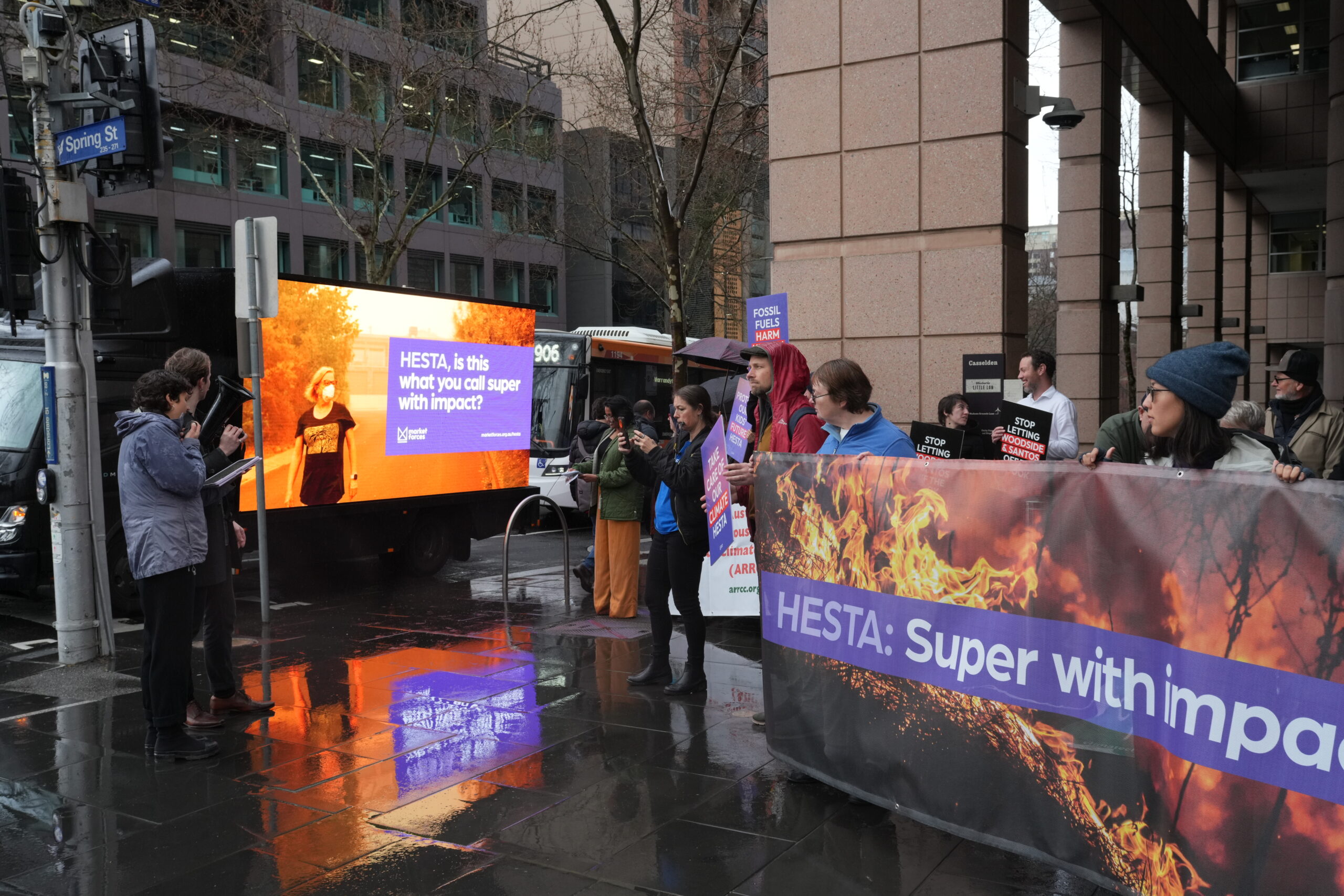 Members and health workers rallied outside HESTA’s Melbourne office in the rain last week.